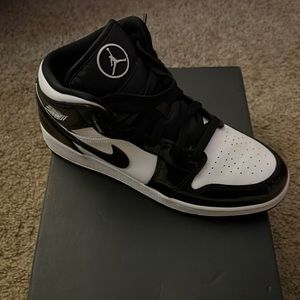 Women’s size 8.5 or kids 7 jordan mid black white patent leather trim